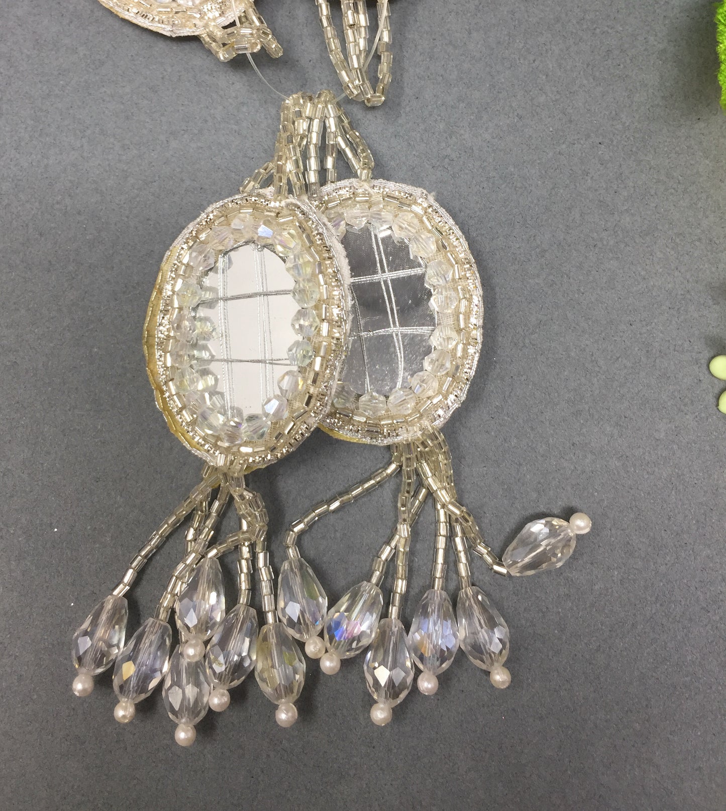 silver tassel mirror