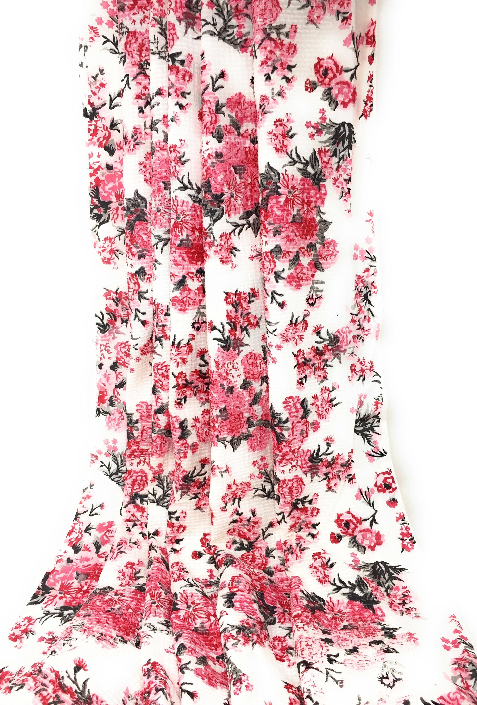 Cotton blend fabric floral print and self colour embroidery.