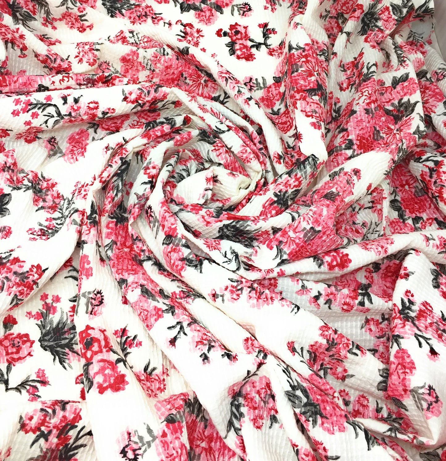 Cotton blend fabric with fuky floral print and self colour embroidery